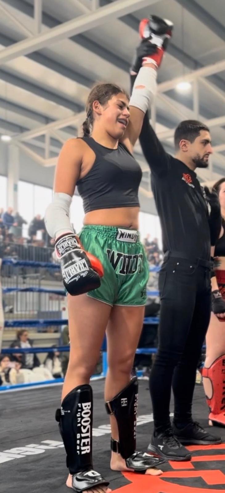 Lucero fighter raising arm in victory